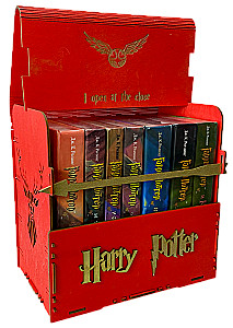 Red book set of Harry Potter in a wooden chest