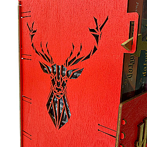 Red book set of Harry Potter in a wooden chest