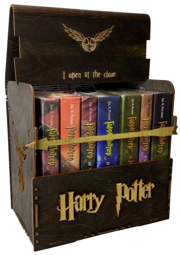 Black set of Harry Potter books in a wooden chest