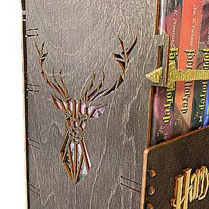 Black set of Harry Potter books in a wooden chest