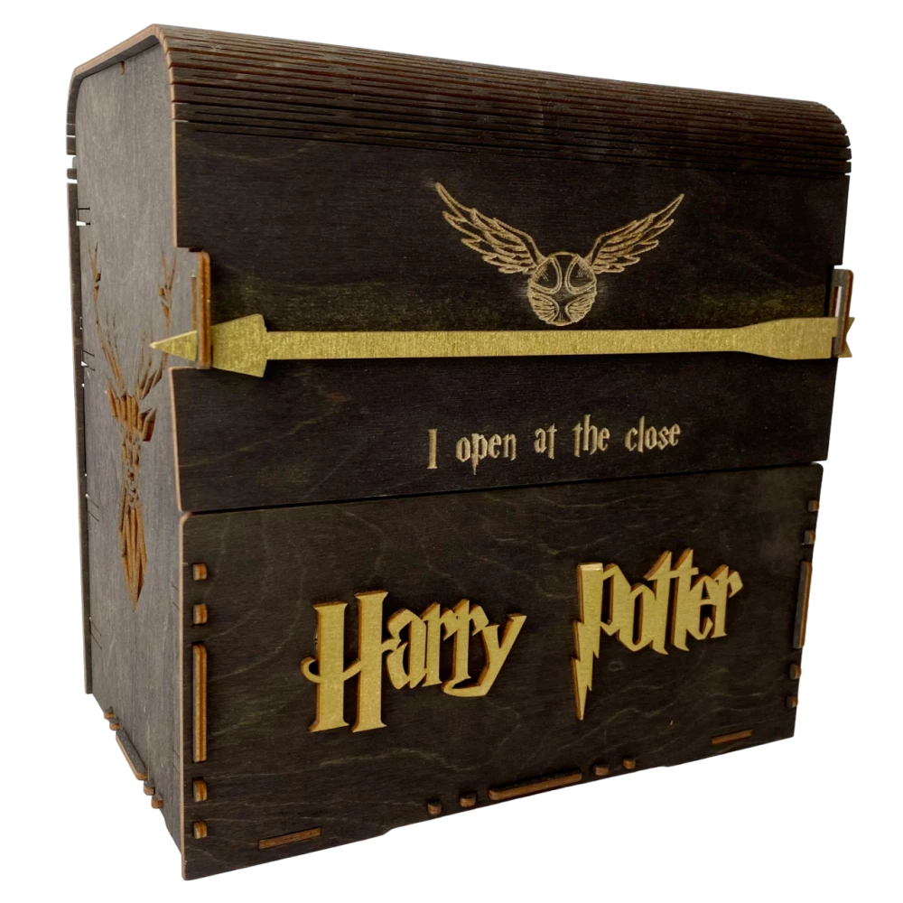 Black set of Harry Potter books in a wooden chest